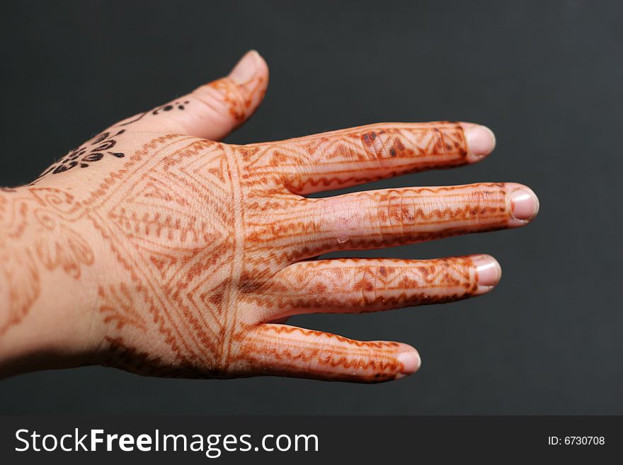 A hand painted with Henna. A hand painted with Henna