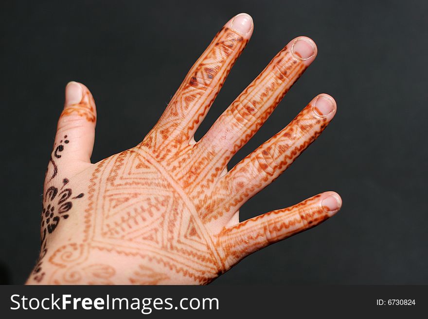 A hand painted with Henna. A hand painted with Henna