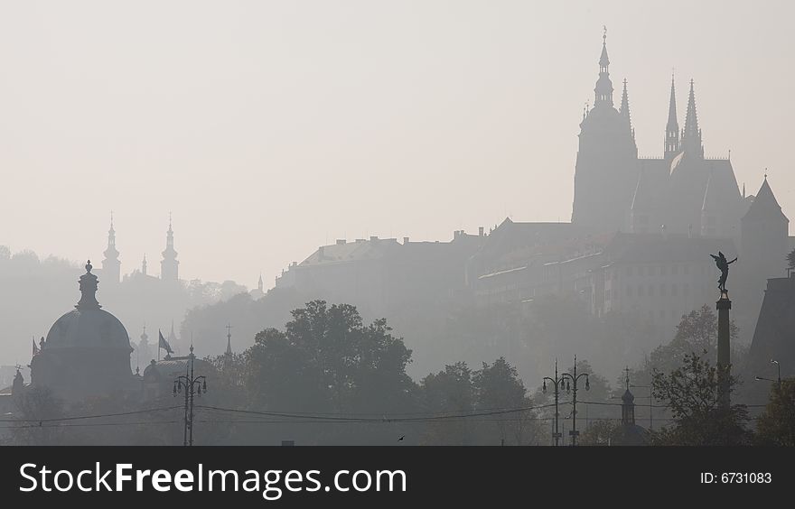 Foggy view to Little quarter and Prague castle. Foggy view to Little quarter and Prague castle.