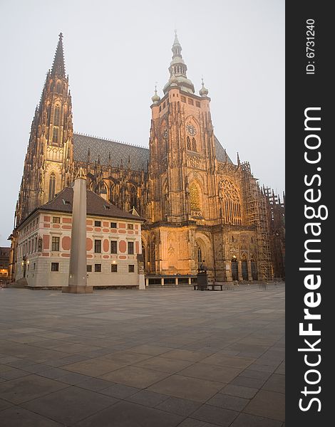 Gothic towers of the famous cathedral of St. Vitus in Prague are touching the fog. Gothic towers of the famous cathedral of St. Vitus in Prague are touching the fog.