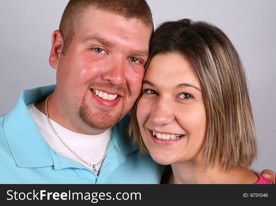 A man and woman share a funny, happy moment. A man and woman share a funny, happy moment.