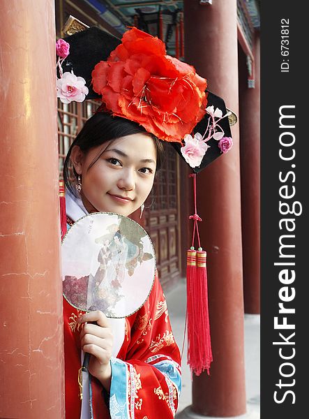 A beautiful girl in Chinese ancient dress is in the royal garden.

Chinese on the fan is meant and missed. 

This is dress of Qing Dynasty of China. It is the princess' dress too. A beautiful girl in Chinese ancient dress is in the royal garden.

Chinese on the fan is meant and missed. 

This is dress of Qing Dynasty of China. It is the princess' dress too.