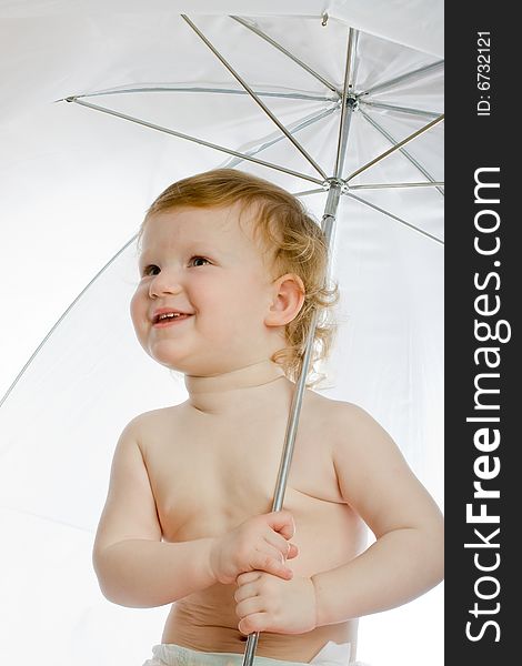 Little child is hiding under the big white umbrella. Little child is hiding under the big white umbrella