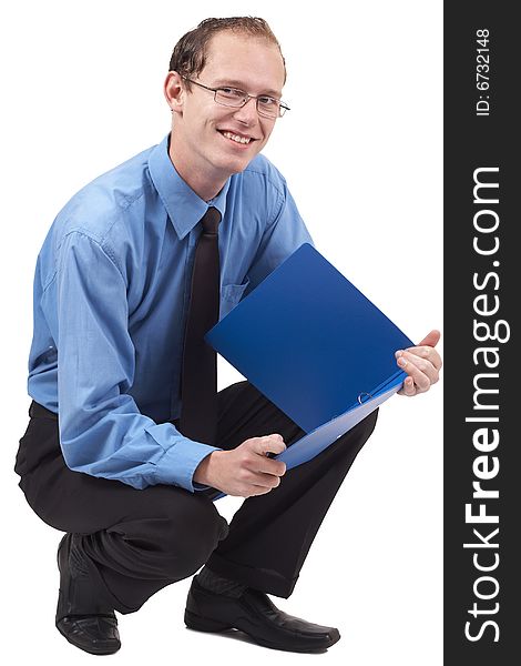 Young successful businessman wearing office clothes sitting with folder. Isolated on white background. Young successful businessman wearing office clothes sitting with folder. Isolated on white background