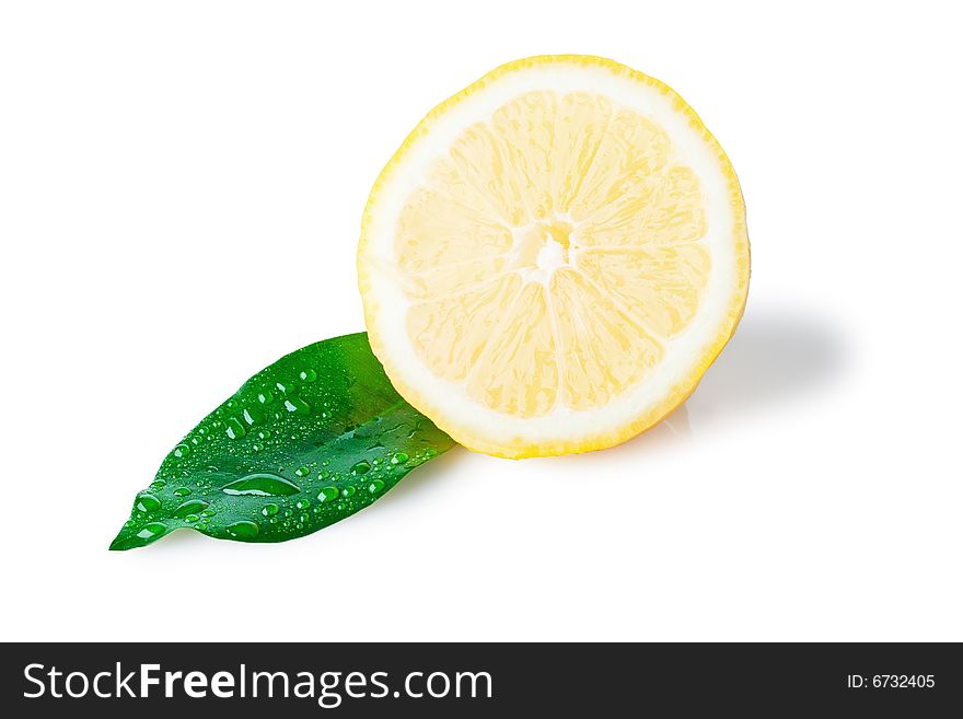 Isolated slice of lemon with wet green leaf, white background. Isolated slice of lemon with wet green leaf, white background