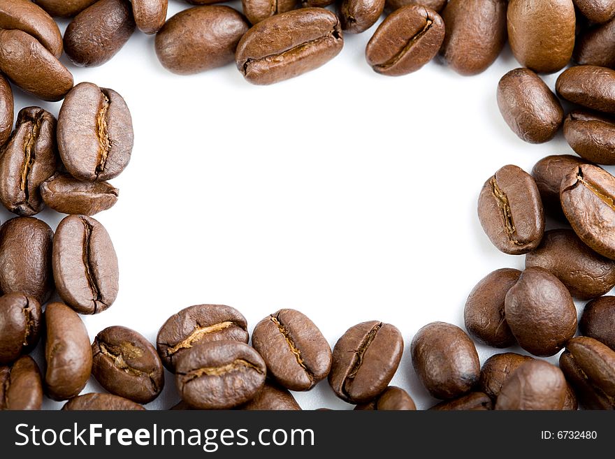 Frame of coffee beans isolated on white