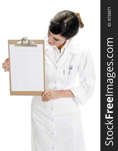 Lady doctor looking paper in writing board with white background