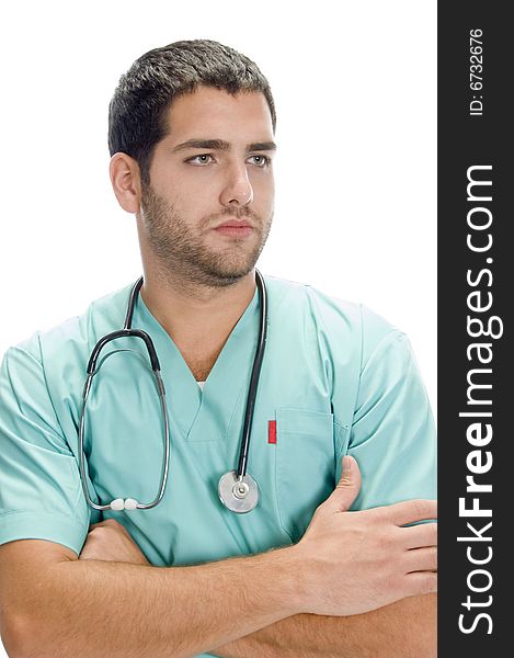 Portrait of handsome doctor against white background