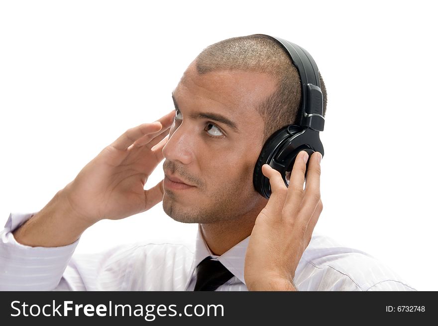 Man holding earphone and looking upward on an isolated background