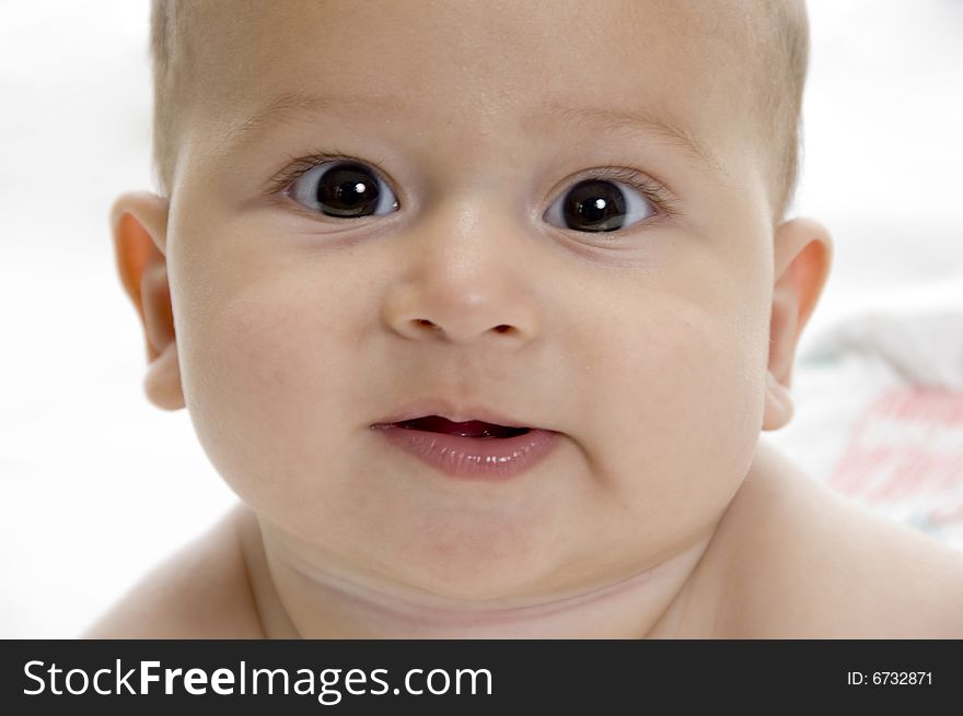 Close up view of cute baby with white background