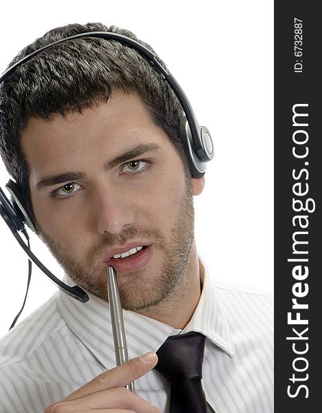 Businessman posing with pen against white background