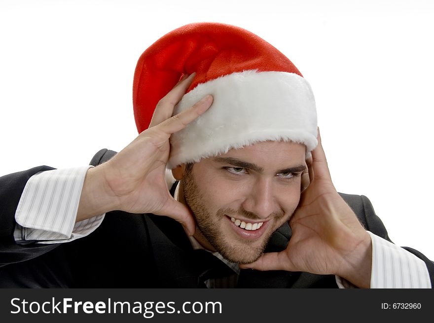 Man posing with santa cap and holding his face on an isolated white background