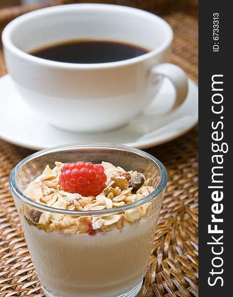 Fresh coffee, orange juice, muesli and yogurt. Fresh coffee, orange juice, muesli and yogurt