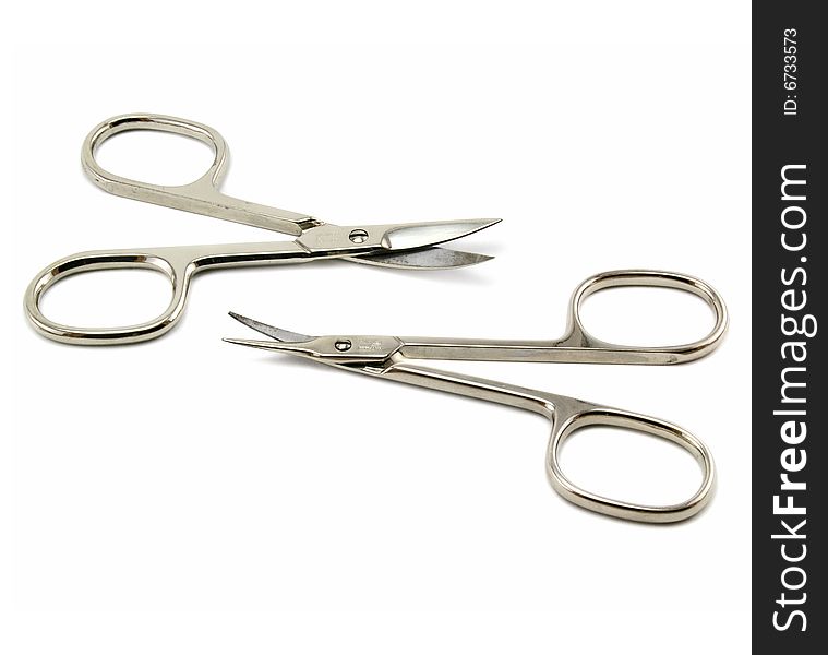 Two nail scissors isolated on a white background. Two nail scissors isolated on a white background