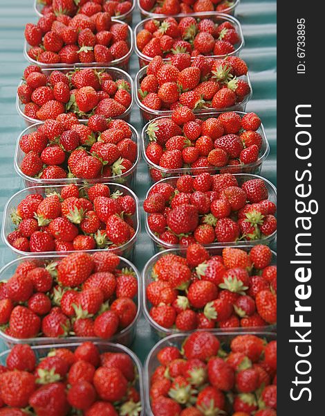 Display of fresh red strawberries in market in France
