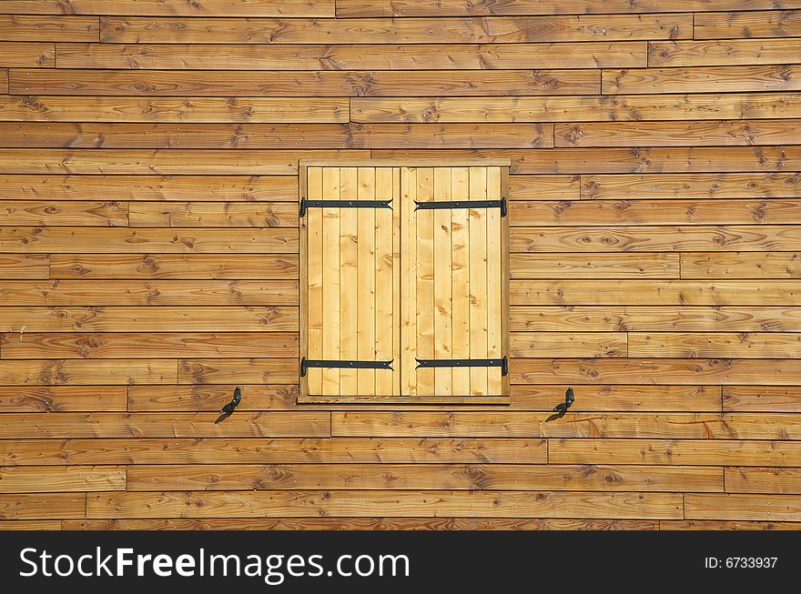 Wooden house wall and shutters as a background. Wooden house wall and shutters as a background