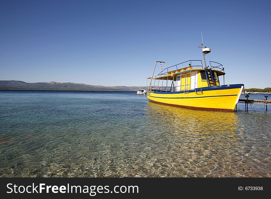 Yellow diving boat on Brac island, Croatia
