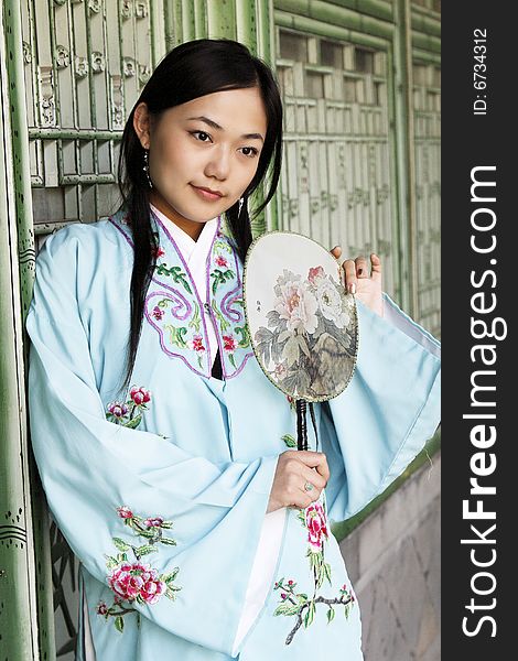 Portrait of a girl in Chinese ancient clothes.

This is dress of Ming Dynasty of China.

Chinese on the fan is peony. Portrait of a girl in Chinese ancient clothes.

This is dress of Ming Dynasty of China.

Chinese on the fan is peony.