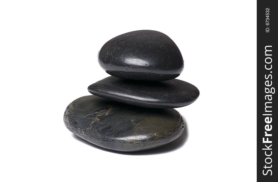 Three stacked stones isolated on white background