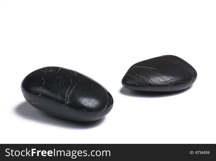 Black stones isolated on a white background. Black stones isolated on a white background