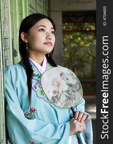 Portrait of a girl in Chinese ancient clothes.

This is dress of Ming Dynasty of China.

Chinese on the fan is peony. Portrait of a girl in Chinese ancient clothes.

This is dress of Ming Dynasty of China.

Chinese on the fan is peony.