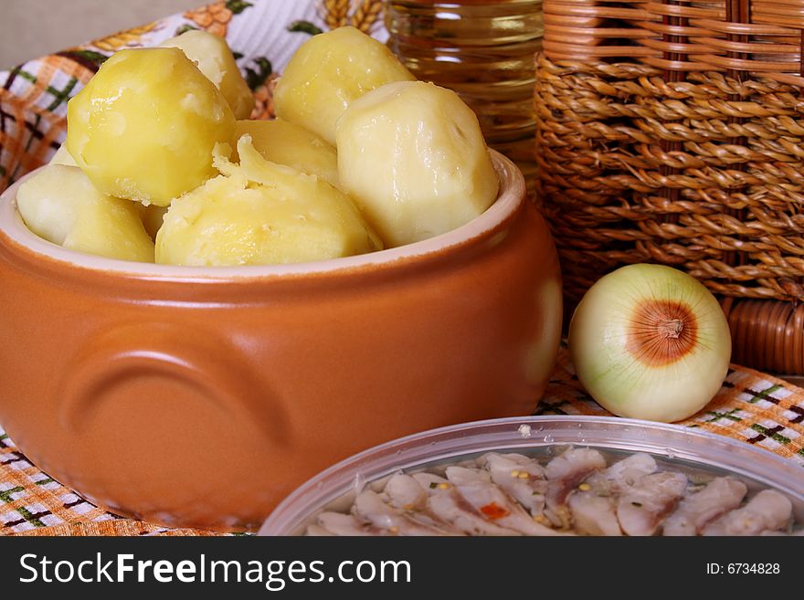 Boiled potato in a ceramic saucepan. Boiled potato in a ceramic saucepan.