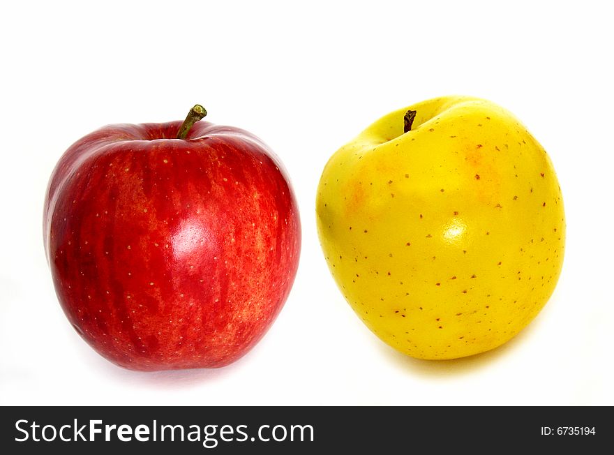 Fresh red and yellow apples over white