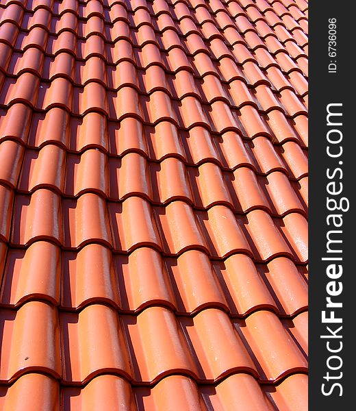 Roof with red tiles - close up. Roof with red tiles - close up