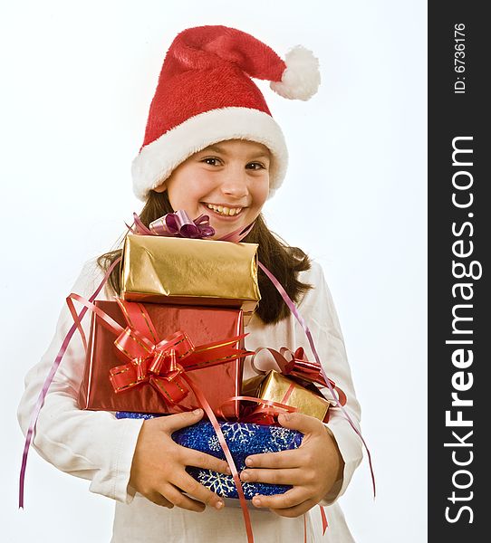 Young girl with hat holding Christmas present. Young girl with hat holding Christmas present