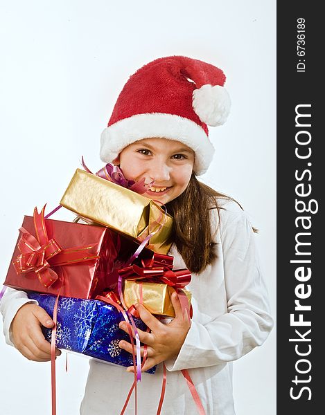 Young girl with hat holding Christmas present. Young girl with hat holding Christmas present