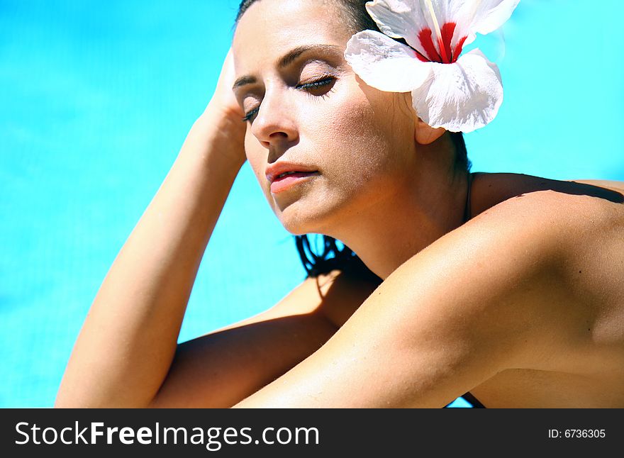 Wet woman with flower in hair. Wet woman with flower in hair