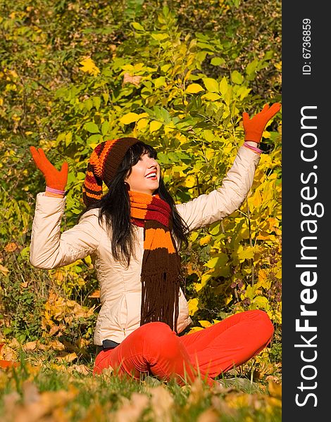 Young woman on the autumn leaf