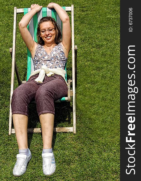 The girl siting at deckchair. The girl siting at deckchair