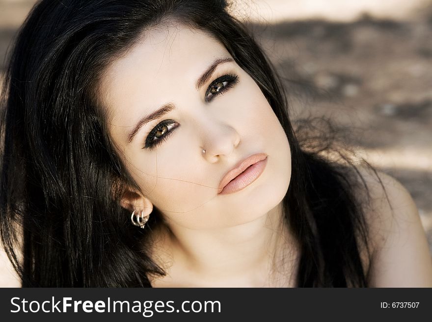 A glamour portrait of a beautiful young brunette woman. A glamour portrait of a beautiful young brunette woman