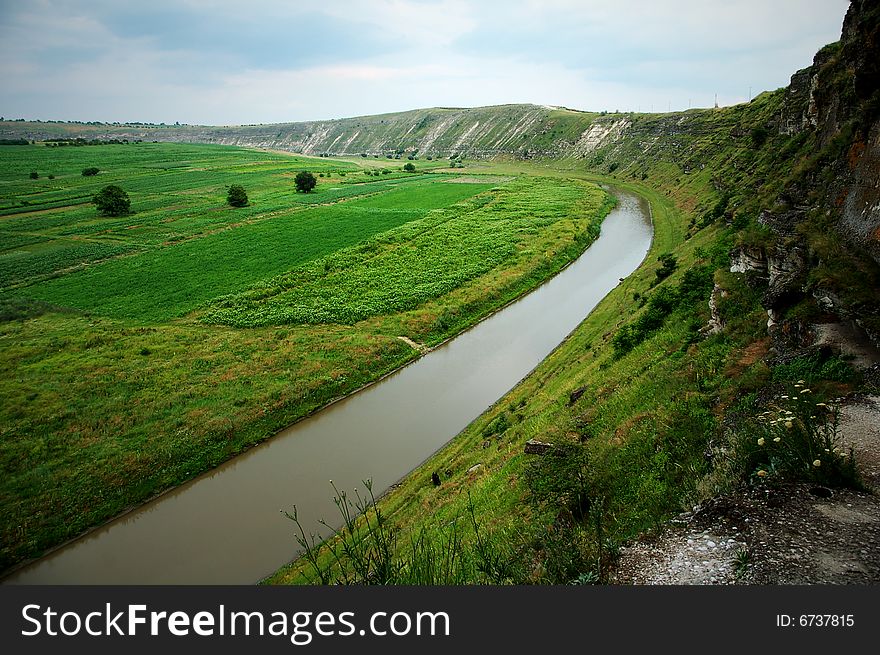 This photograph represent a ecologic landscape with Dniester river flowing. This photograph represent a ecologic landscape with Dniester river flowing.
