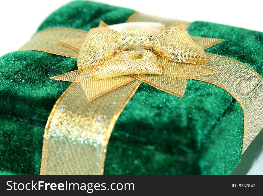 Green velvet gift box with gold ribbon decoration. Green velvet gift box with gold ribbon decoration