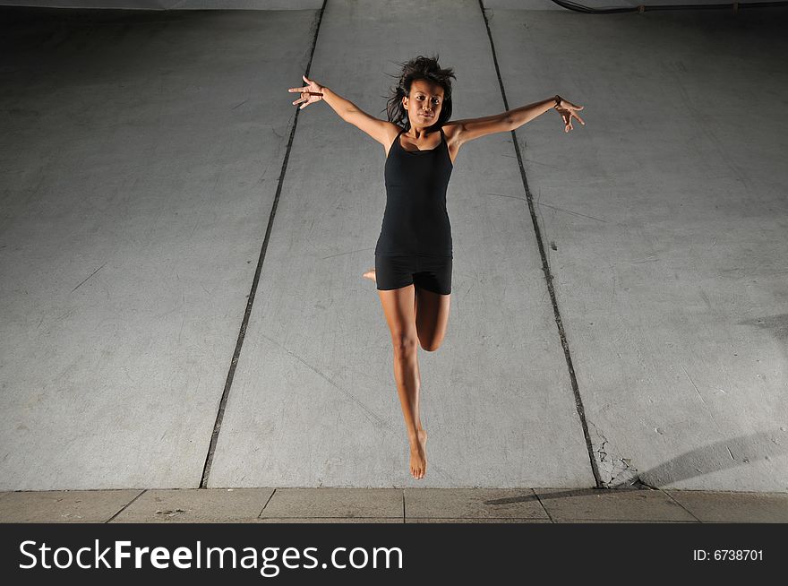 Artistic Picture of a Dancer performing athletic contemporary dance moves. Artistic Picture of a Dancer performing athletic contemporary dance moves.