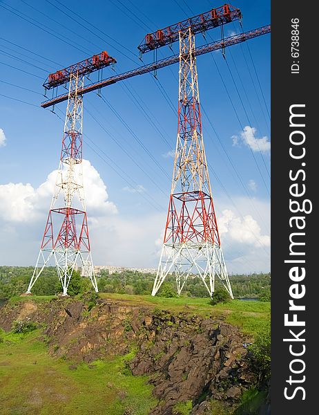 Electric main on the rock against the cloudy sky. Electric main on the rock against the cloudy sky