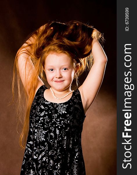 Little girl with luxurious ginger hair