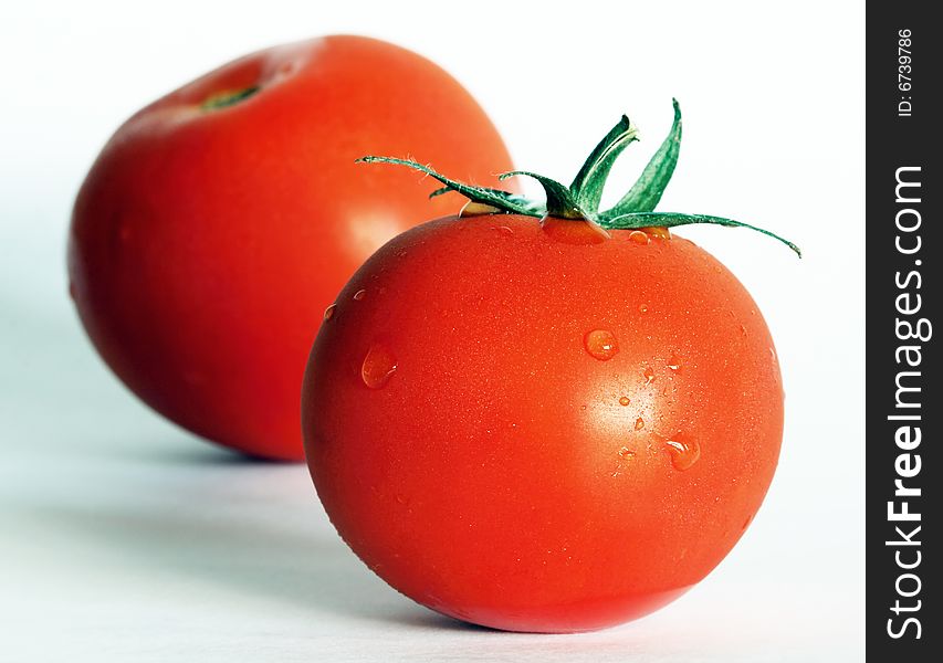 Two big tomatoes with white background. Two big tomatoes with white background