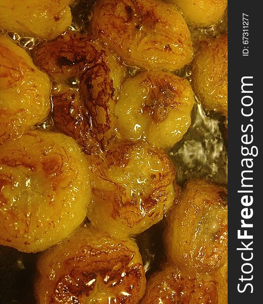 Sliced Bananas Being Fried in Oil.