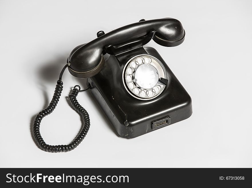 Old black telephone isolated on white. Old black telephone isolated on white