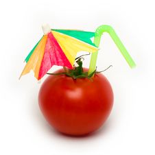 Tomato With Cocktail Umbrella. Stock Images Tomato With Cocktail Umbrella. Stock Images