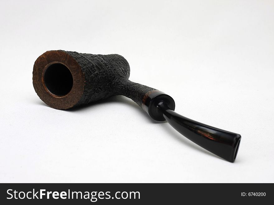 An black tobacco pipe isolated on white background from Denmark.