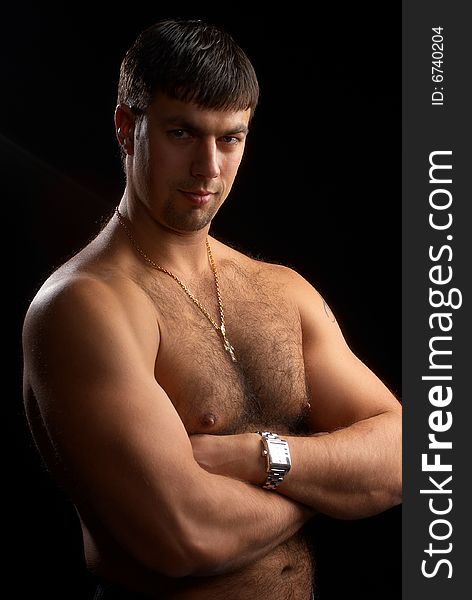 Portrait of a strong muscular man, isolated on black background. Portrait of a strong muscular man, isolated on black background