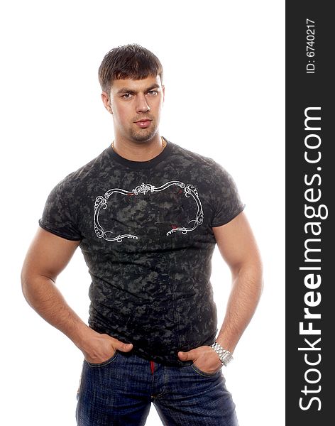 Young sexy muscular man wearing t-shirt and jeans, isolated on white background. Young sexy muscular man wearing t-shirt and jeans, isolated on white background