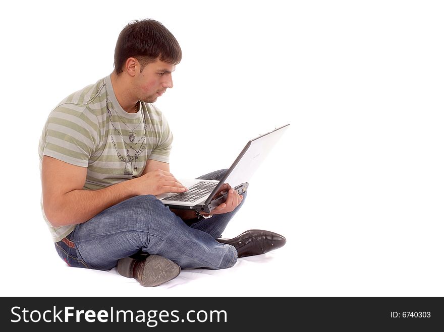 Contemporary looking guy working with laptop, isolated on white background. Contemporary looking guy working with laptop, isolated on white background