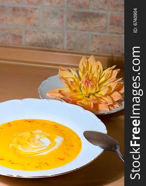 Tasty pumpkin soup with cream and paprika