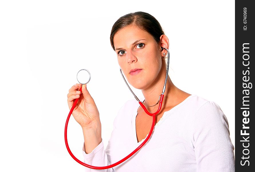 A young female doctor with a stethoscope around the neck ready for examination. Isolated over white. A young female doctor with a stethoscope around the neck ready for examination. Isolated over white.