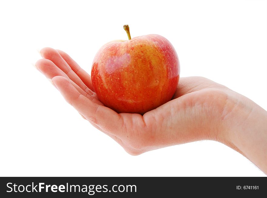 An Isolated image of a whole apple held in a hand. An Isolated image of a whole apple held in a hand